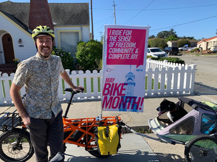 matt miller on bike with dog mara